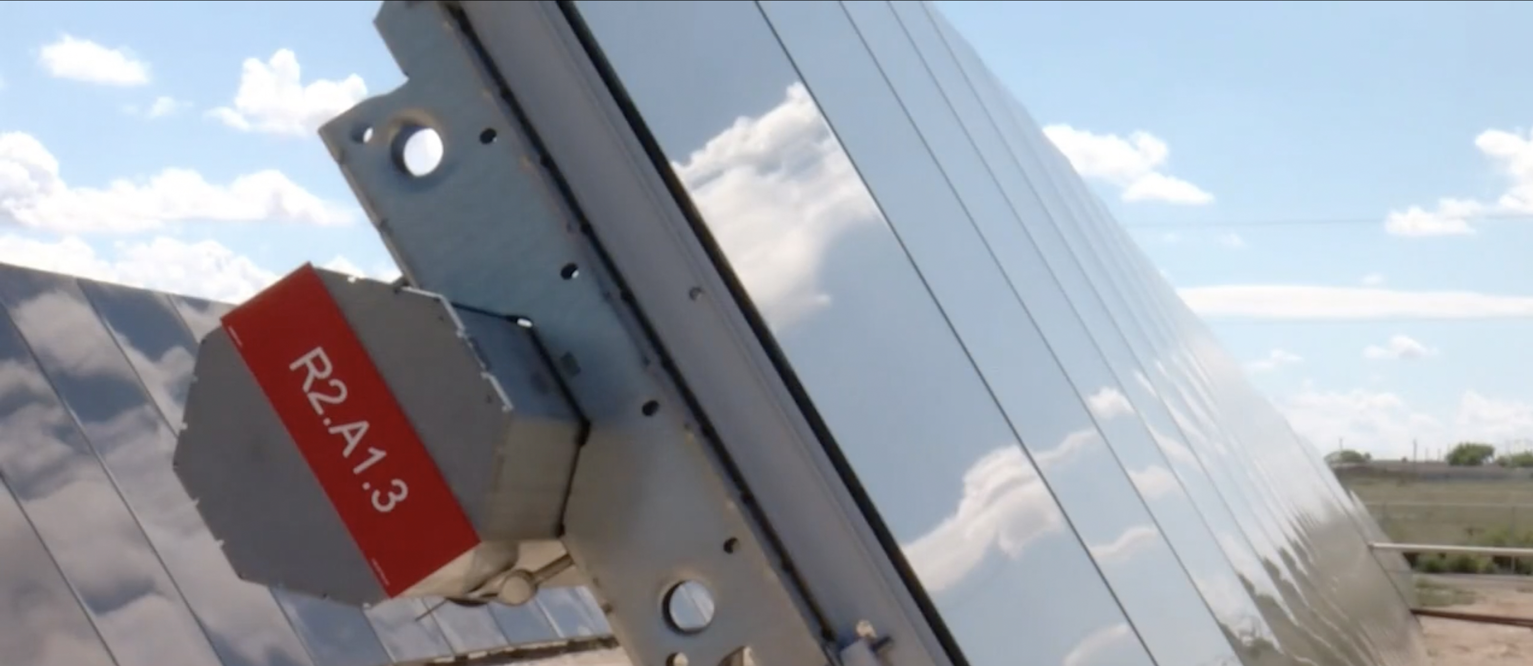 Close-up of tracker hardware and labeled row on the Belen community solar array
