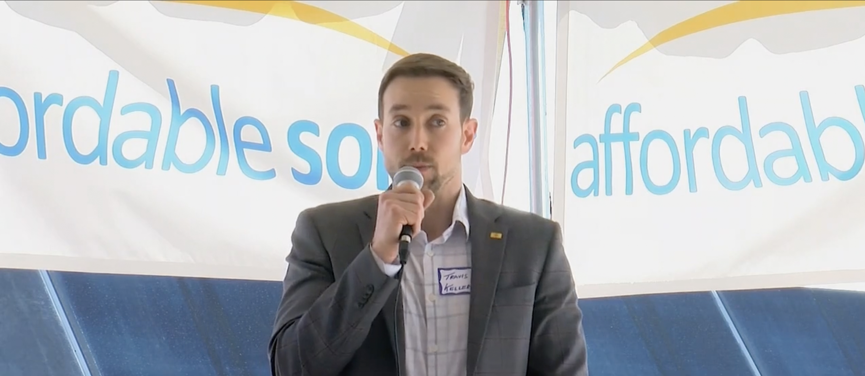 Portrait of a project spokesperson speaking at the Belen community solar ribbon‑cutting